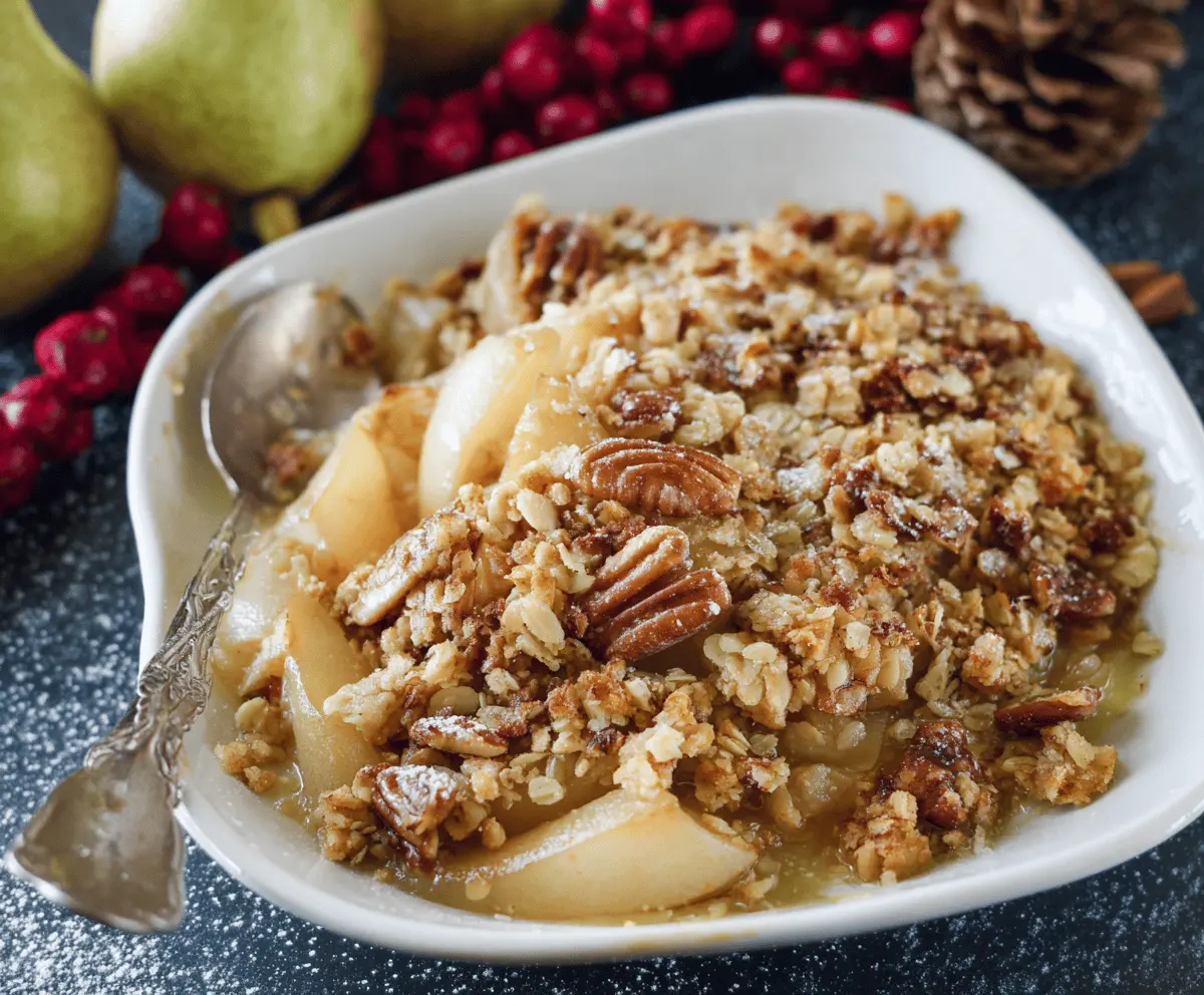 Delicious homemade Holiday Pear Crumble topped with golden, flaky crust and fresh pear slices, perfect for festive dessert celebrations