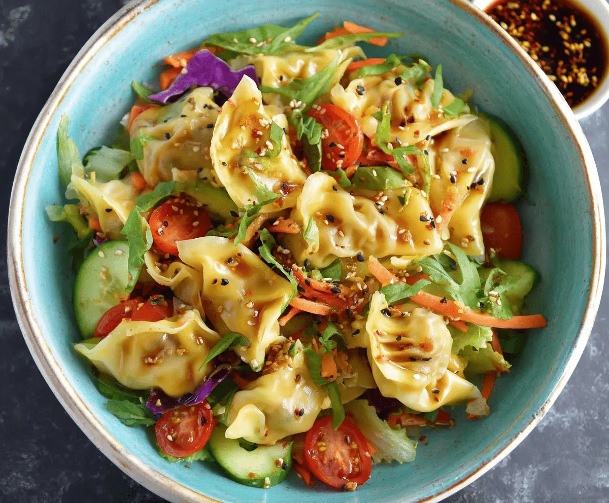 Delicious potsticker salad with crispy potstickers, fresh greens, and flavorful Asian-inspired dressing, perfect for a quick and tasty meal.