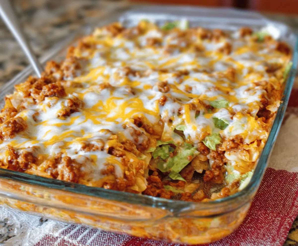 Delicious homemade easy cabbage roll casserole with layers of seasoned cabbage and savory filling.