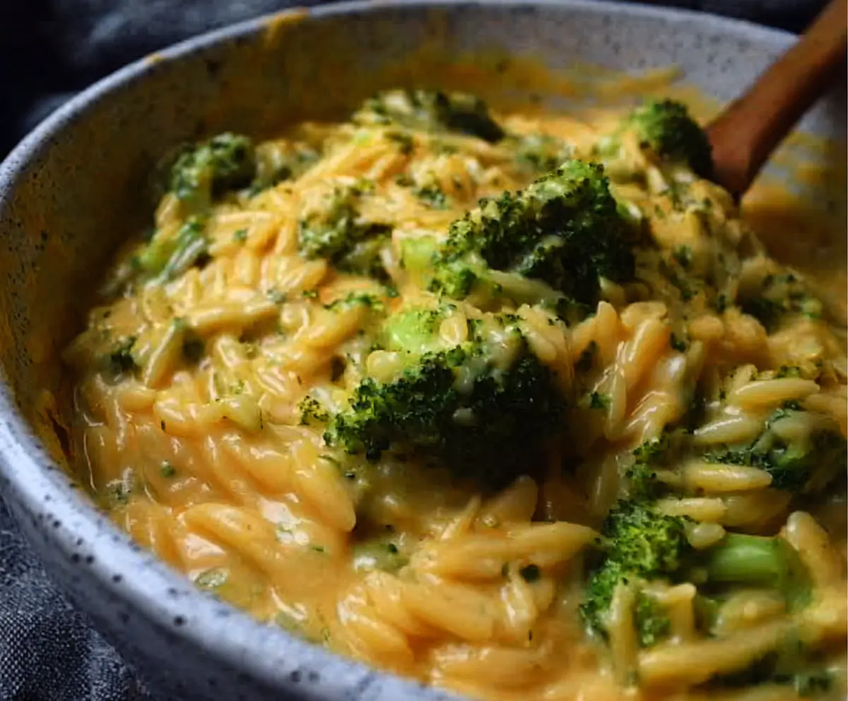 Delicious creamy one-pot broccoli cheddar orzo served in a bowl, showcasing a cheesy and nutritious pasta dish.
