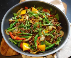 Delicious garlic pork stir fry with fresh vegetables served in a bowl