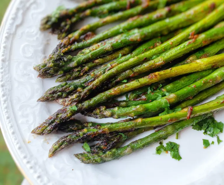 Delicious Garam Masala Grilled Asparagus on a plate, highlighting Indian-spiced roasted asparagus.