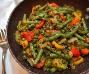 Colorful peas and peppers stir fry in a wok, fresh and vibrant vegetable dish