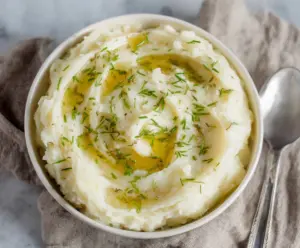 Creamy Whole30 mashed potatoes served in a rustic bowl, perfect for a healthy side dish.